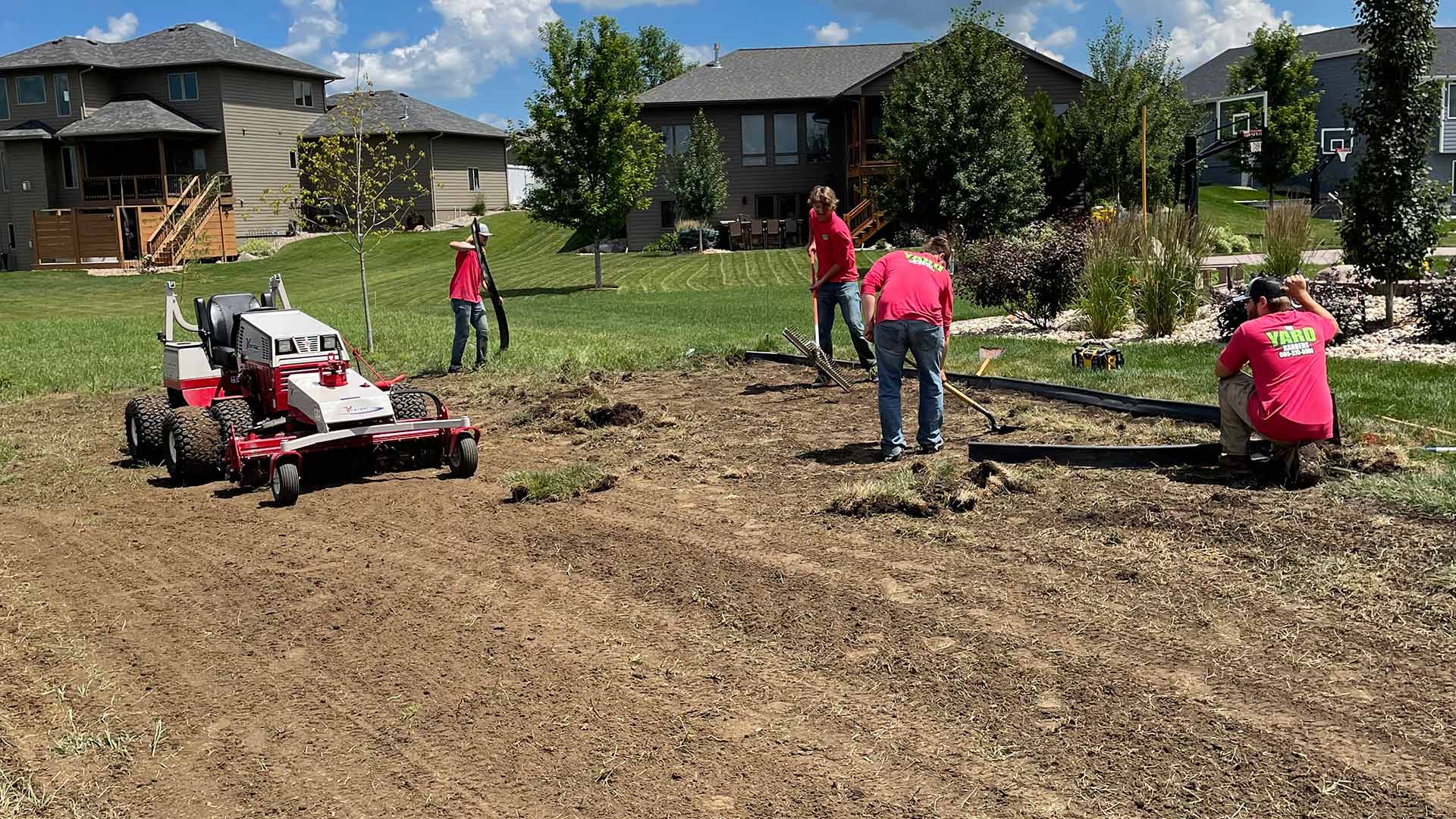 Lawn and landscape workers clearing a yard near Sioux Falls, SD.