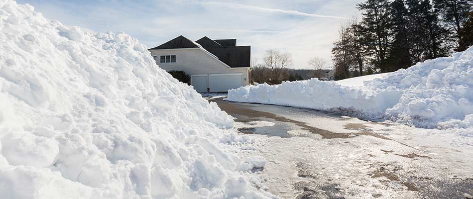 A home in Tea, SD with snow plowed from driveway.
