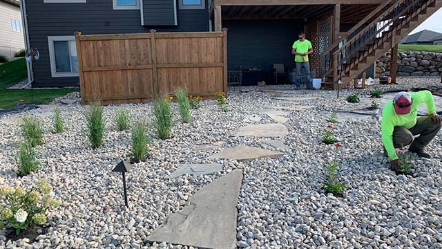 Large landscape bed with plants and rock mulch near Tea, SD.
